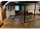 View of unfinished basement with door and possible utility sink, providing ample storage or renovation possibilities at 3662 Greentree Farms Dr, Decatur, GA 30034