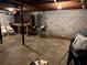 Unfinished basement shows a workbench and concrete floor, ready to be transformed into additional living space at 3662 Greentree Farms Dr, Decatur, GA 30034
