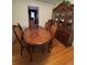 Elegant dining room with a wooden table, ornate chairs, and a display cabinet at 3662 Greentree Farms Dr, Decatur, GA 30034