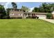 Charming brick home with a well-manicured lawn and inviting curb appeal at 3662 Greentree Farms Dr, Decatur, GA 30034