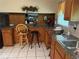 Functional kitchen with ample counter space, wooden cabinetry, and neutral tile flooring at 3662 Greentree Farms Dr, Decatur, GA 30034