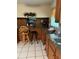Functional kitchen with ample counter space, wooden cabinetry, and neutral tile flooring at 3662 Greentree Farms Dr, Decatur, GA 30034