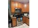 Updated kitchen featuring stainless steel appliances, granite countertops, and modern fixtures at 3662 Greentree Farms Dr, Decatur, GA 30034