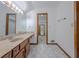 Bathroom featuring a marble countertop, and a view to an adjacent room at 3835 Shawnee Sw Run, Lilburn, GA 30047