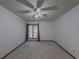 Bedroom featuring carpet, large window, curtains, and ample space at 3835 Shawnee Sw Run, Lilburn, GA 30047