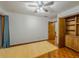 Bedroom featuring wood floors, built-ins and a large window at 3835 Shawnee Sw Run, Lilburn, GA 30047