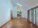 Dining room with parquet floors and decorative chandelier, opening to living spaces at 3835 Shawnee Sw Run, Lilburn, GA 30047