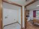 Laundry room features tile flooring and access to dining room at 3835 Shawnee Sw Run, Lilburn, GA 30047