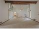 Large living room with a ceiling fan, high ceilings, and multiple windows for natural light at 3835 Shawnee Sw Run, Lilburn, GA 30047