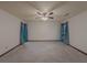A spacious main bedroom with a ceiling fan and large windows at 3835 Shawnee Sw Run, Lilburn, GA 30047