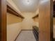 A walk-in closet featuring high mounted shelving and a six-drawer cabinet at 3835 Shawnee Sw Run, Lilburn, GA 30047