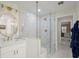 Luxurious bathroom featuring glass shower, white vanity, updated fixtures, and great natural light at 40 Ivy Chase Ne, Atlanta, GA 30342