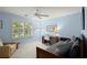 Stylish bedroom featuring a comfortable daybed, desk, and ample natural light from the window at 40 Ivy Chase Ne, Atlanta, GA 30342