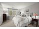 Bright bedroom with a large window, comfortable bed, soft carpet, and charming decor at 40 Ivy Chase Ne, Atlanta, GA 30342