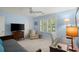 Inviting bedroom with a ceiling fan, shutters, desk, and cozy chair for relaxing and working at 40 Ivy Chase Ne, Atlanta, GA 30342