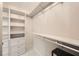 Walk-in closet with custom shelving and drawers providing ample storage at 40 Ivy Chase Ne, Atlanta, GA 30342
