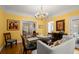 Elegant dining room with yellow walls, hardwood floors, classic table and chairs, plus vintage artwork at 40 Ivy Chase Ne, Atlanta, GA 30342