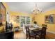 Sunlit dining room with classic design, hardwood floors, and traditional decor at 40 Ivy Chase Ne, Atlanta, GA 30342