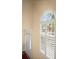 Bright entryway with two story ceiling, transom window and white entry door at 40 Ivy Chase Ne, Atlanta, GA 30342