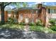Charming brick two-story townhouse with a well-manicured lawn and walkway leading to the front entrance at 40 Ivy Chase Ne, Atlanta, GA 30342
