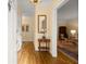 Inviting foyer with gleaming hardwood floors, cream-colored walls, and elegant lighting fixture at 40 Ivy Chase Ne, Atlanta, GA 30342