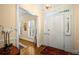 Bright foyer features wood floors, neutral walls, white trim, and sidelights around the front door at 40 Ivy Chase Ne, Atlanta, GA 30342