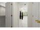 Bright hallway with white tile floors, linen closet and access to the walk-in closet at 40 Ivy Chase Ne, Atlanta, GA 30342
