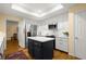 Well-lit kitchen with an island, stainless steel appliances, and white cabinets underneath a skylight at 40 Ivy Chase Ne, Atlanta, GA 30342