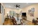 Comfortable living room with a ceiling fan, natural light from the window, and hardwood flooring at 40 Ivy Chase Ne, Atlanta, GA 30342