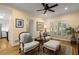 Comfortable living room space with two chairs, ottoman, ceiling fan, and hardwood floors at 40 Ivy Chase Ne, Atlanta, GA 30342