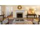 Comfortable living room with a fireplace, hardwood floors, and classic furnishings at 40 Ivy Chase Ne, Atlanta, GA 30342