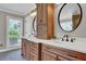 Dual sinks and quartz countertops are the focal point in this bathroom at 5950 Meadow Brook Ln, Cumming, GA 30040