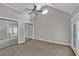 Spacious bedroom features vaulted ceilings and glass paneled doors at 5950 Meadow Brook Ln, Cumming, GA 30040
