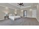 This spacious bedroom features a ceiling fan and neutral colors at 5950 Meadow Brook Ln, Cumming, GA 30040