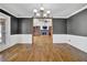 Elegant dining room featuring hardwood floors and crown molding at 5950 Meadow Brook Ln, Cumming, GA 30040