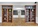 Elegant living room featuring hardwood floors and built-in bookshelves at 5950 Meadow Brook Ln, Cumming, GA 30040