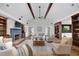 Inviting living room with a cozy fireplace, built-in bookshelves, and comfortable seating arrangements at 5950 Meadow Brook Ln, Cumming, GA 30040