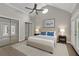 Large main bedroom with vaulted ceiling, fan, ample closet space and plenty of natural light at 5950 Meadow Brook Ln, Cumming, GA 30040