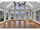Bright sunroom with vaulted ceiling, skylights, and view of the pool area at 5950 Meadow Brook Ln, Cumming, GA 30040
