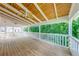 Open porch with a ceiling fan and view to green tree foliage at 1265 Kelly Nelson Dr, Lawrenceville, GA 30043