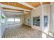 Spacious back porch, perfect for entertaining, with a paneled ceiling, fan, and neighborhood view at 1265 Kelly Nelson Dr, Lawrenceville, GA 30043