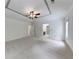 Spacious bedroom with plush carpeting, a decorative ceiling, and open doorways at 1265 Kelly Nelson Dr, Lawrenceville, GA 30043