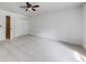 Expansive bedroom featuring plush carpeting, modern ceiling fan, and spacious closet at 1265 Kelly Nelson Dr, Lawrenceville, GA 30043
