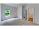 Spacious carpeted bedroom with a bright window and an open doorway at 1265 Kelly Nelson Dr, Lawrenceville, GA 30043
