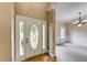 Foyer showcasing hardwood floors, textured walls, and an elegant chandelier at 1265 Kelly Nelson Dr, Lawrenceville, GA 30043