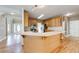 Spacious kitchen with wooden cabinets, light countertops and tile backsplash at 1265 Kelly Nelson Dr, Lawrenceville, GA 30043