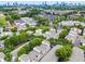 Aerial view of community highlighting colorful townhomes and city skyline at 1271 Ponti Nw Mews # 92, Atlanta, GA 30318