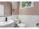 Powder bathroom with white subway tile wainscoting and a modern sink fixture at 1271 Ponti Nw Mews # 92, Atlanta, GA 30318