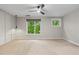Large bedroom with two windows, a ceiling fan and modern decorative wall trim at 1271 Ponti Nw Mews # 92, Atlanta, GA 30318