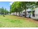 Community park with lush grass and benches near townhomes at 1271 Ponti Nw Mews # 92, Atlanta, GA 30318